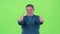 Middle aged man is showing a thumbs up. Green screen