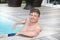 Middle aged man sit in pool relax in vaction day