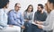 Middle-aged man sitting at support group session, telling about alcohol addiction