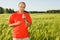 Middle-aged man smiling on a field