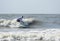 Middle aged man surfing a long board on the Atlatic Ocean in South Carolina