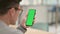 Middle Aged Man Using Green Key Smartphone Screen