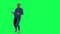 Middle aged man walking with full hands from right angle on green screen