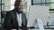 Middle-aged professional manager african adult millennial man work on computer business commerce online develop website
