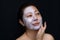 A middle-aged woman Asians are happy with a face mask for skin c