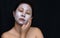 A middle-aged woman Asians are happy with a face mask for skin c