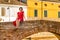 Middle-aged woman on bridge in lagoon town