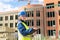 A middle-aged woman at a construction site works and checks