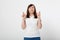 Middle aged woman crossing her fingers and wishing for good luck. Blank white t-shirt, mock up. Fashion outfit Mother day