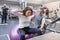 Middle-aged woman doing sports exercise in fitness center. Personal gym trainer assisting mature woman. Health fitness sport age