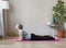 Middle aged woman doing yoga indoors