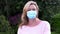 Middle aged woman in her forties outside wearing a face mask during Coronavirus COVID-19 Pandemic