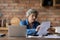 Middle-aged woman holding document checking bank statement