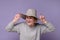 Middle aged woman i nsummer hat finding new idea and raising index finger