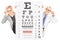 Middle aged woman and a male optician standing behind eyesight t