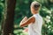 Middle Aged Woman Practicing Tai Chi Chuan in the Park. Close Up On Hands Position