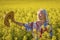 A middle-aged woman in the rapeseed chain