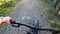 Middle aged woman riding a mountain bike in the forest