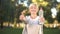 Middle-aged woman showing bottle of water and thumbs up, healthy lifestyle