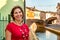 Middle-aged woman walking in a lagoon town