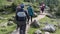 middle-aged women hiking on alpine footpath