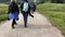 middle-aged women hiking on alpine footpath