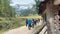 middle-aged women hiking on alpine footpath