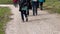 middle-aged women hiking on alpine footpath