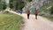 middle-aged women hiking on alpine footpath