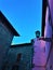 Middle Ages construction, street lamp, pink wall and sky in Vitorchiano town, Italy