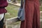 Middle ages reconstructed woman fashion dress and handbag medieval festival reportage photo textile cloth center