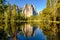 Middle Cathedral Rock reflecting in Merced River at Yosemite