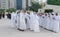 Middle Eastern Culture - Emirati Men performing Al Ayala traditional dance - Arabic men in traditional cloth