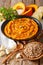 Middle Eastern food: pumpkin hummus with ingredients close-up. v