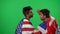 Middle Eastern football fans arguing as British team wins American talking at chromakey background. Young men cheering