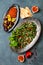 Middle Eastern traditional dinner. Authentic arab cuisine. Meze party food. Tabbouleh, muhammara, olives.