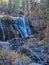 The Middle Falls on the McCloud River is adorned in autumn foliage at the Shasta Trinity National Forest, California, USA