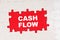 In the middle of the puzzles on a red background it is written - CASH FLOW