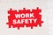 In the middle of the puzzles on a red background it is written - WORK SAFETY