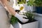 Middle selection on woman in working gloves preparing for landing on balcony