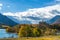 Middle Waterton Lake lakeshore in autumn foliage season sunny day morning.