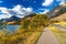 Middle Waterton Lake lakeshore in autumn foliage season sunny day morning.