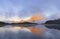 The Midi d`Ossau mountain between clouds is reflected in the gentau lake, Ayous Lakes, Pyrenees