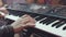 MIDI keyboard synthesizer piano keys. Stock. Woman playing the synthesizer. A music instrument background, music concept