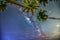 Midnight landscape with coconut palm tree Silhouette and Milky Way in the sky