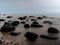 Midnight Serenity: Long Exposure Reveals the Sea\\\'s Mystical Touch on Stones in Darkness