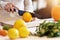 Midsection of adult woman in the kitchen preparing pumpkin dishes for Halloween