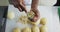 Midsection of african american female chef peeling potatoes in restaurant kitchen