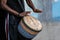 Midsection of african man playing djembe drums