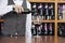 Midsection Of Bartender Pouring Red Wine In Glass